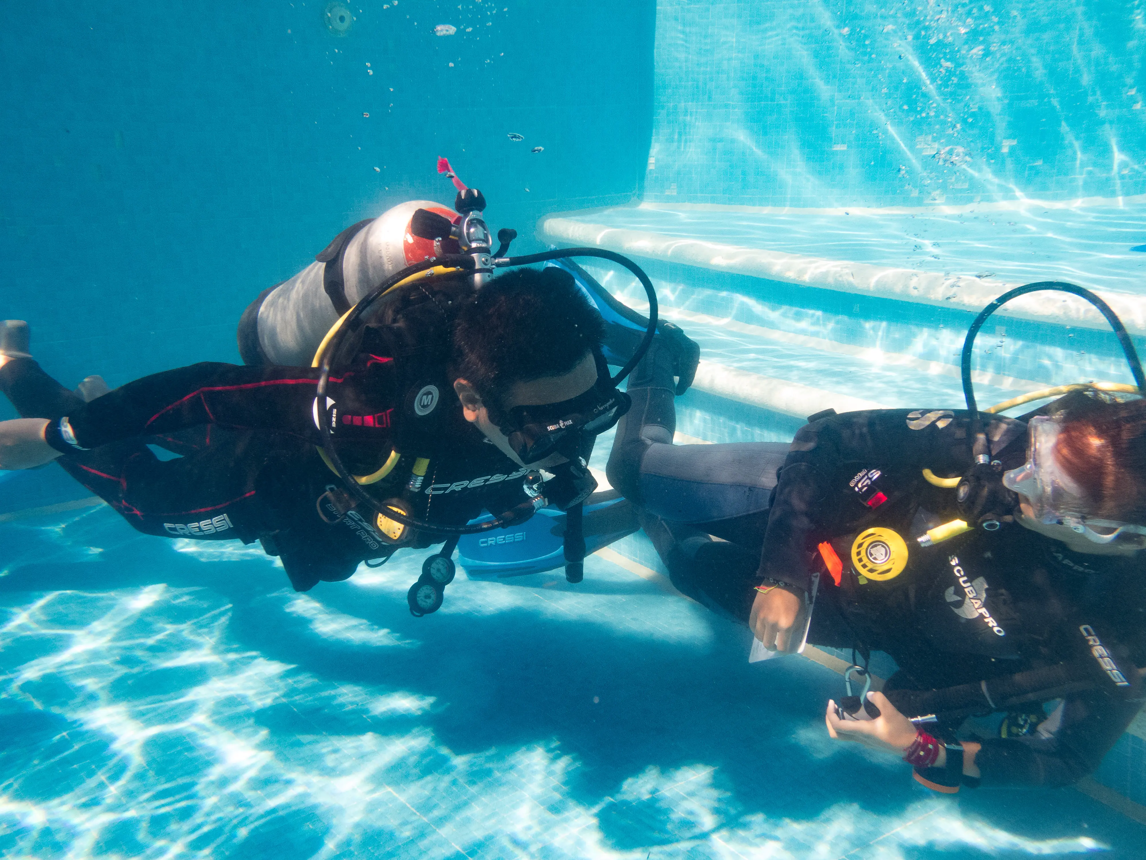 An instructor and student in the pool