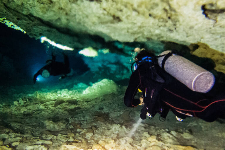 Two divers with blurry water