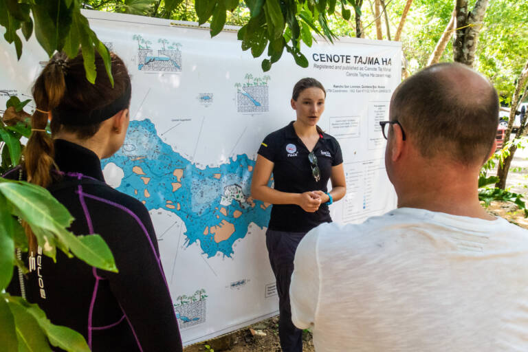 An instructor gives a briefing at a cenote