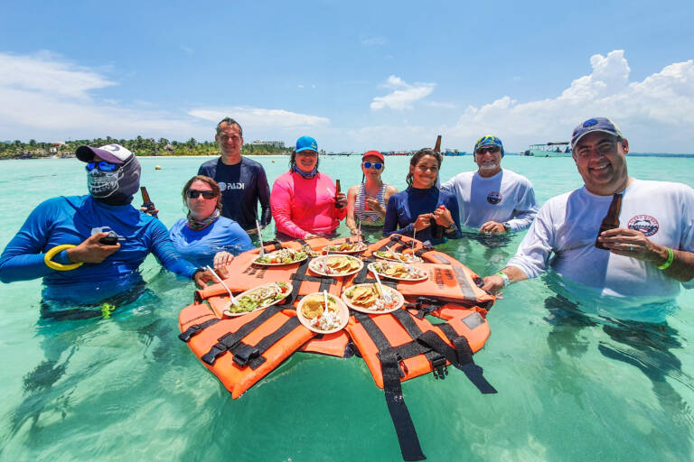 People eating in the ocean